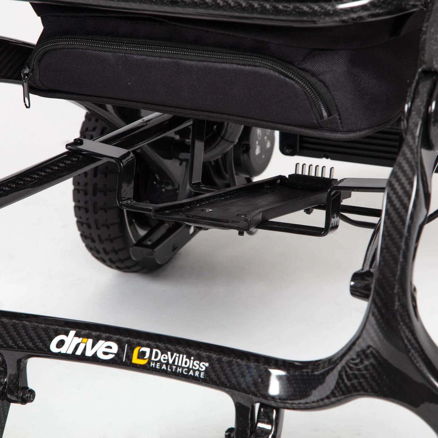 Black Drive AirFold power wheelchair with compact design and sturdy frame, suitable for indoor and outdoor mobility.