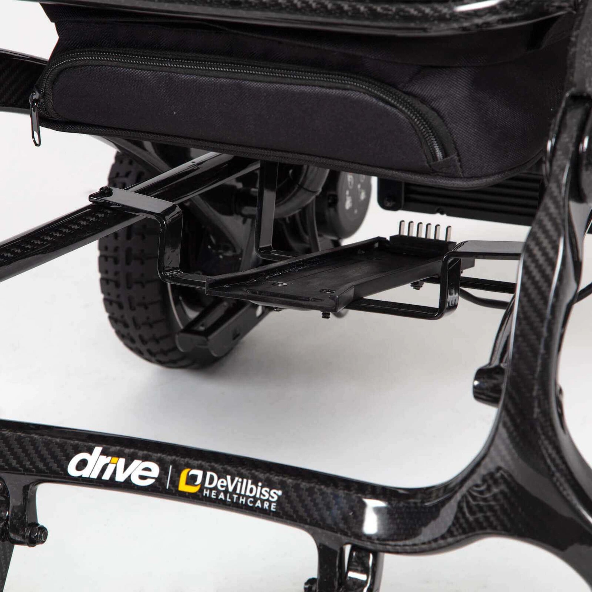 Black Drive AirFold power wheelchair with compact design and sturdy frame, suitable for indoor and outdoor mobility.