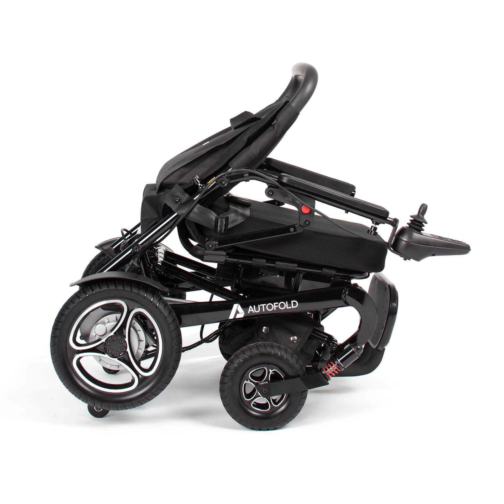 Drive AutoFold powerchair in black, showing the compact design, armrests, and footrest for easy mobility and portability.