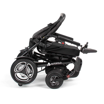 Drive AutoFold powerchair in black, showing the compact design, armrests, and footrest for easy mobility and portability.