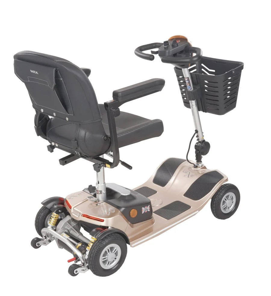 Electric Mobility Rascal Luxe Champagne mobility scooter viewed from the back, showcasing its compact design and sturdy frame.