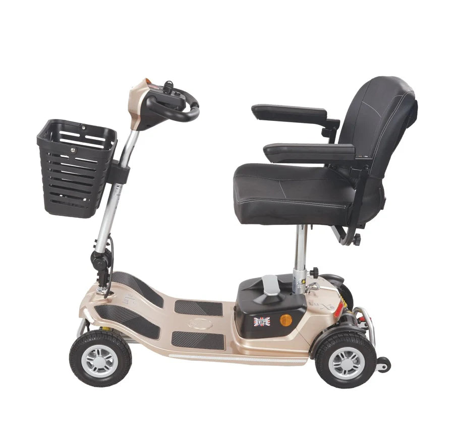 Electric Mobility Rascal Luxe Champagne mobility scooter viewed from the side, showing its sleek design and comfortable seat.