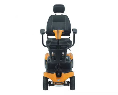Orange Rascal Vista DX mobility scooter by Electric Mobility, showing its compact design and comfortable seating.