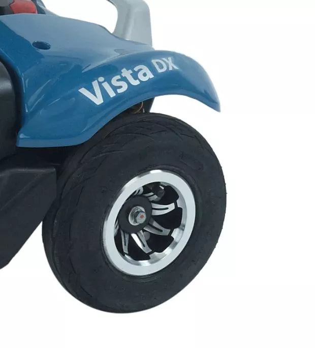 Wheel of the Rascal Vista DX mobility scooter by Electric Mobility, showing the sturdy design and large tire for outdoor use.